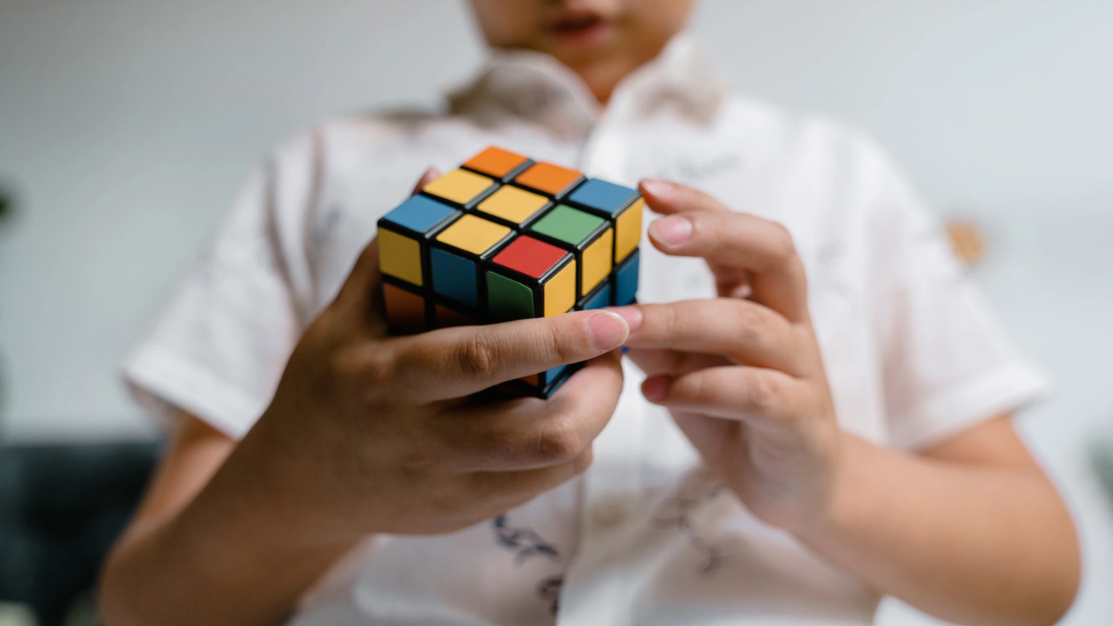 A kid solving Rubik's cube
