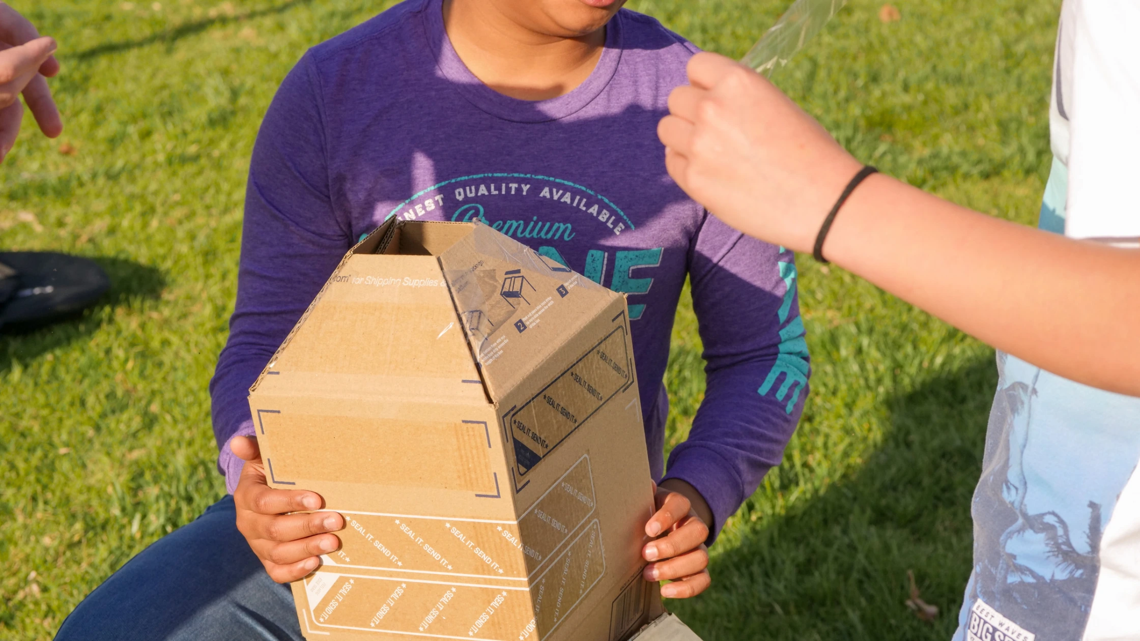A boy with a cardboard project