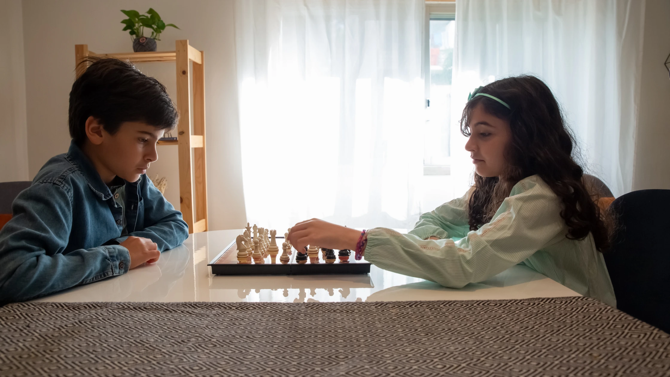 Two children playing chess